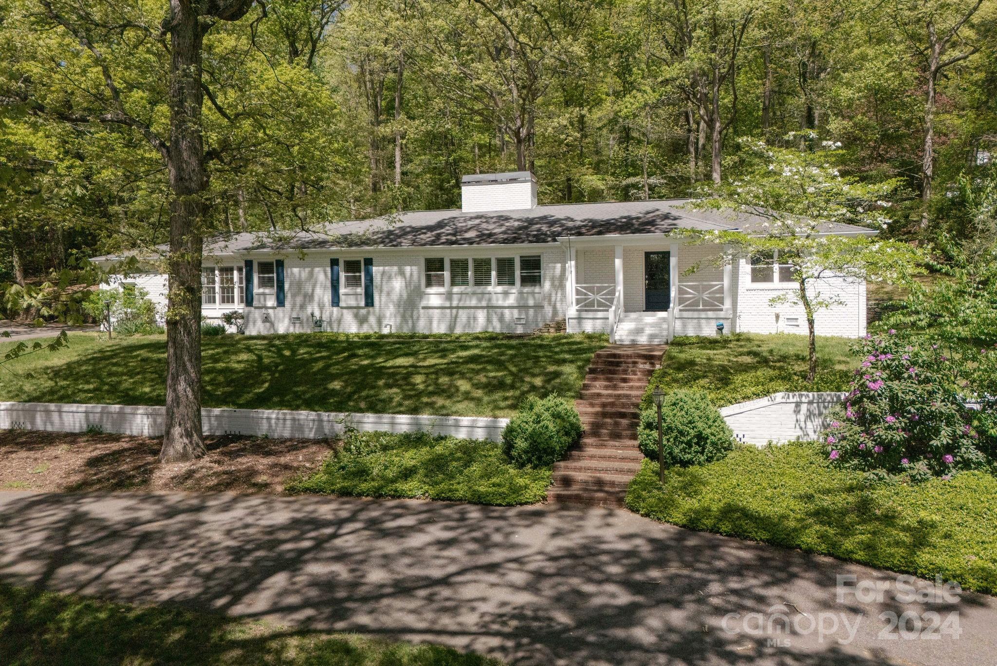 51 Forest Road Asheville, NC 28803 - Photo 2 of 45 a front view of a house with a yard