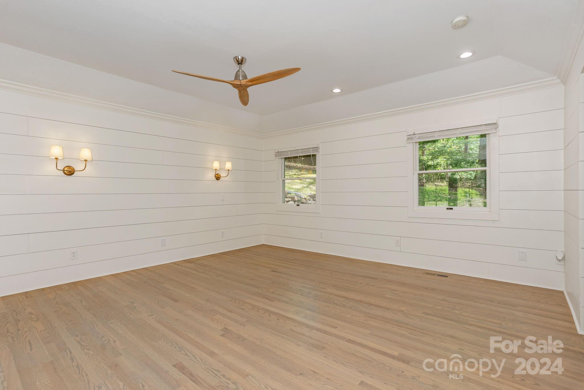 51 Forest Road Asheville, NC 28803 - Photo 21 of 45 an empty room with wooden floor and windows