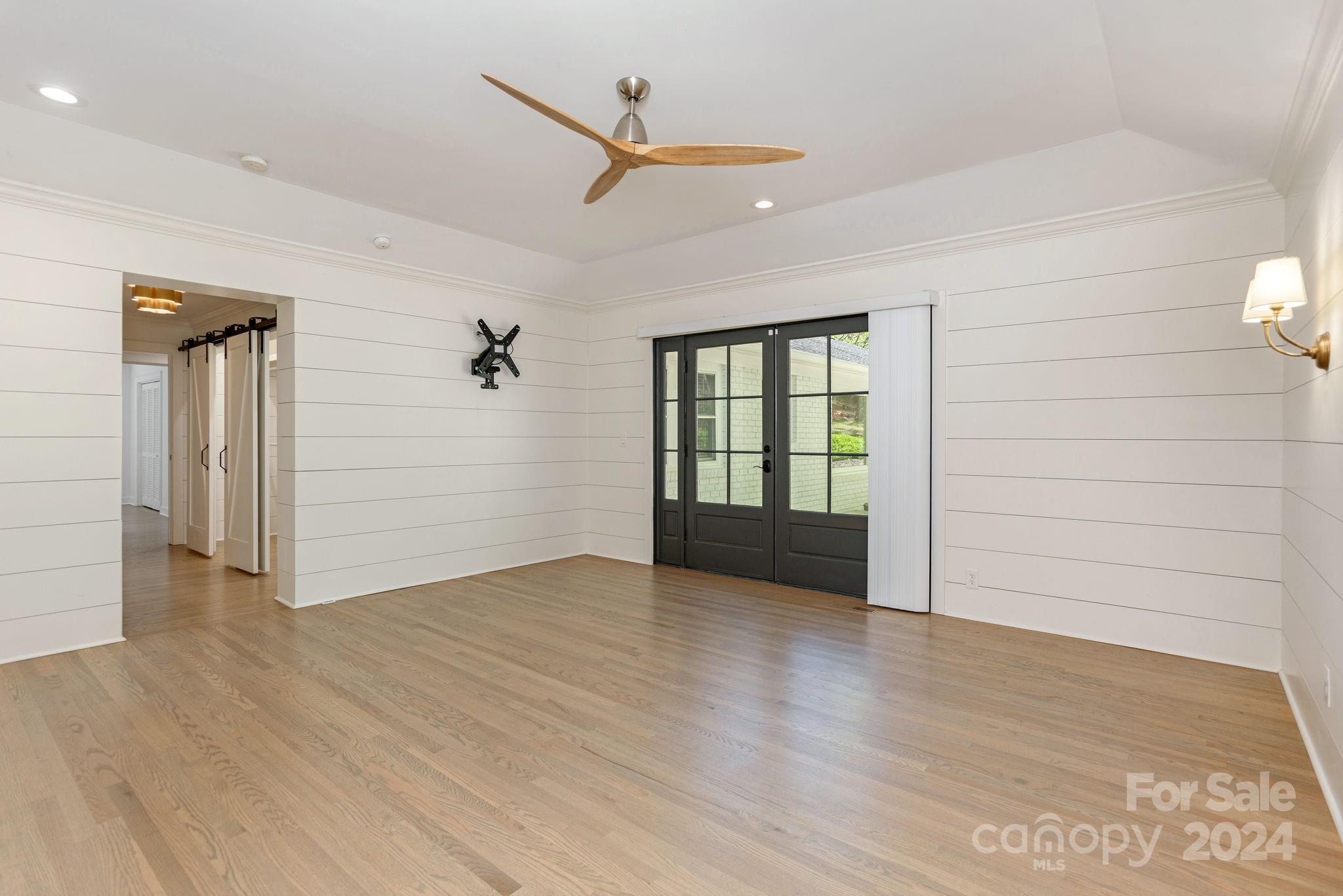 51 Forest Road Asheville, NC 28803 - Photo 23 of 45 an empty room with wooden floor cabinet and windows