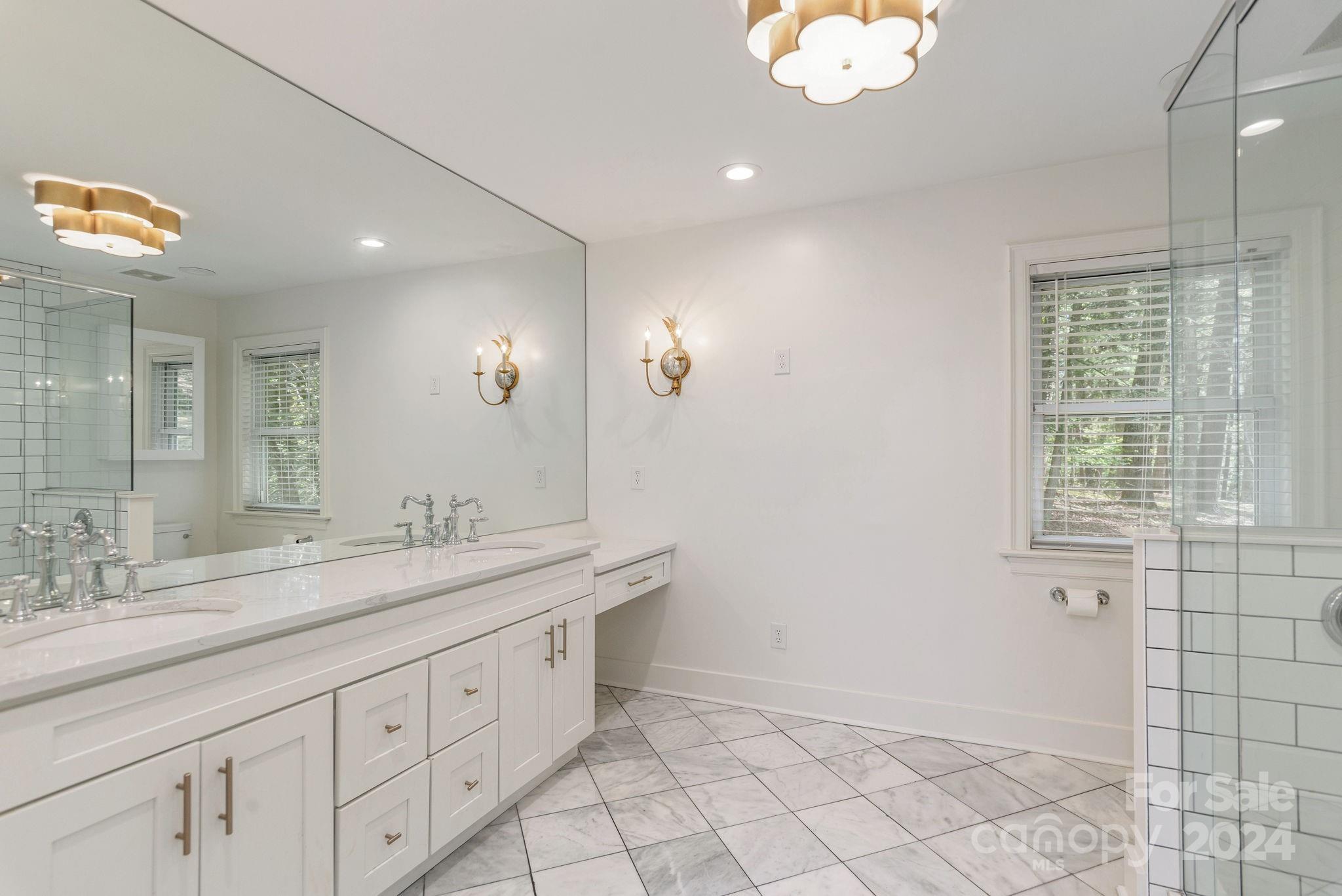 51 Forest Road Asheville, NC 28803 - Photo 24 of 45 a bathroom with a sink a vanity and a mirror
