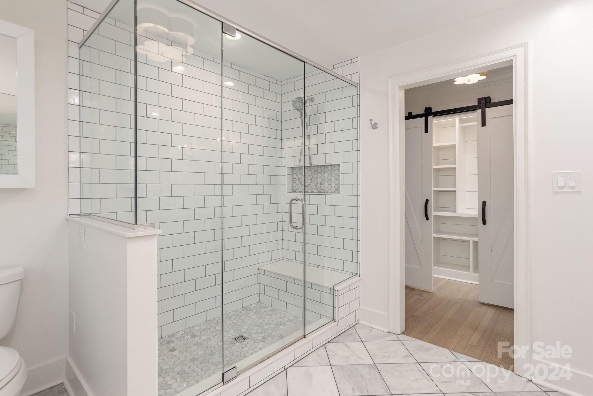 51 Forest Road Asheville, NC 28803 - Photo 25 of 45 a bathroom with a shower and toilet