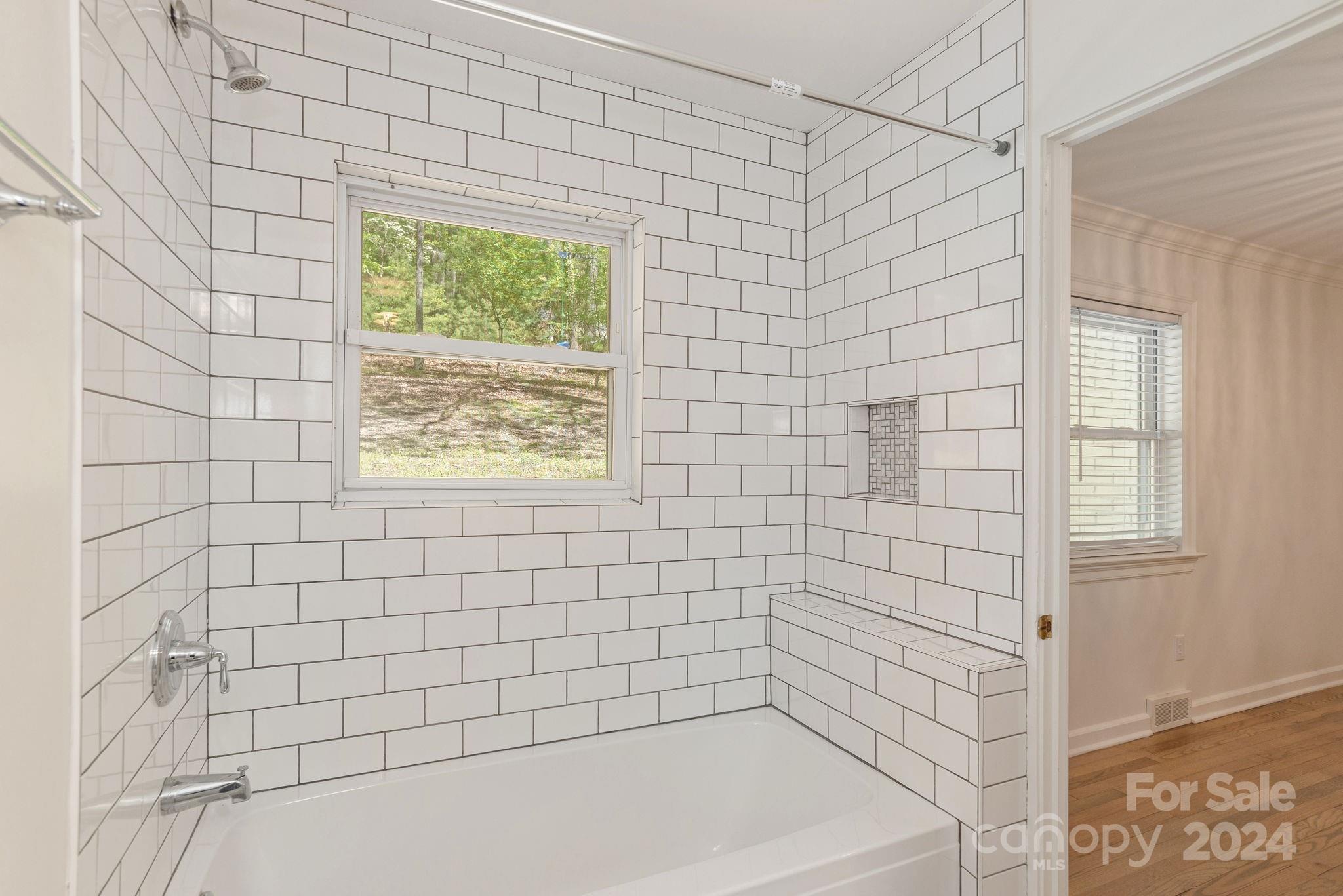 51 Forest Road Asheville, NC 28803 - Photo 30 of 45 a bathroom with a bathtub