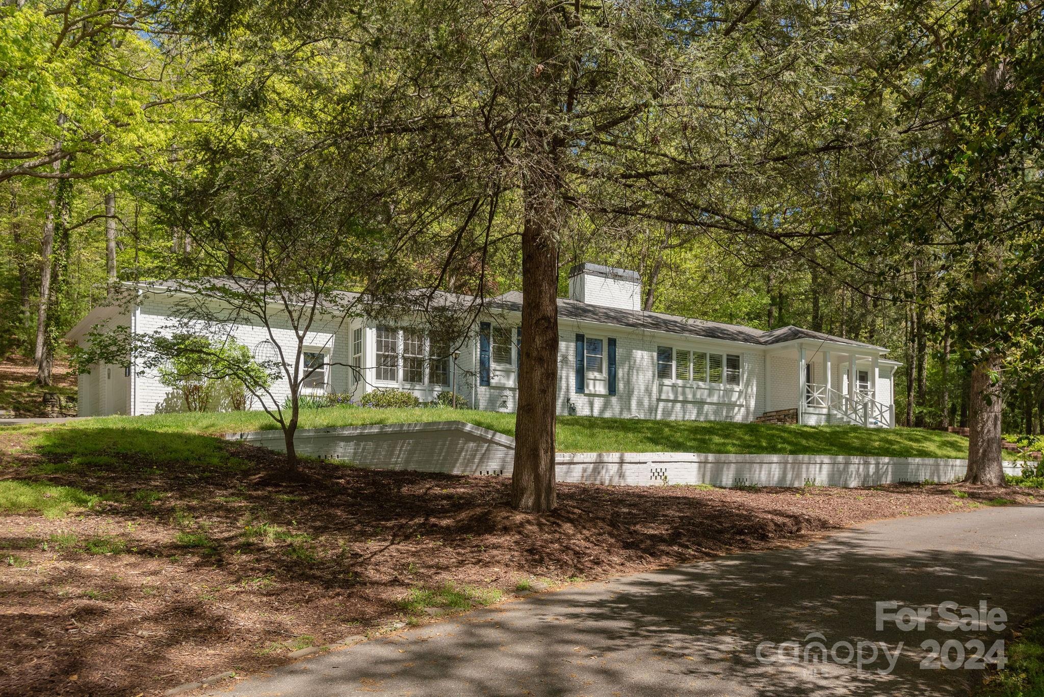 51 Forest Road Asheville, NC 28803 - Photo 3 of 45 a front view of a house with a yard and green space