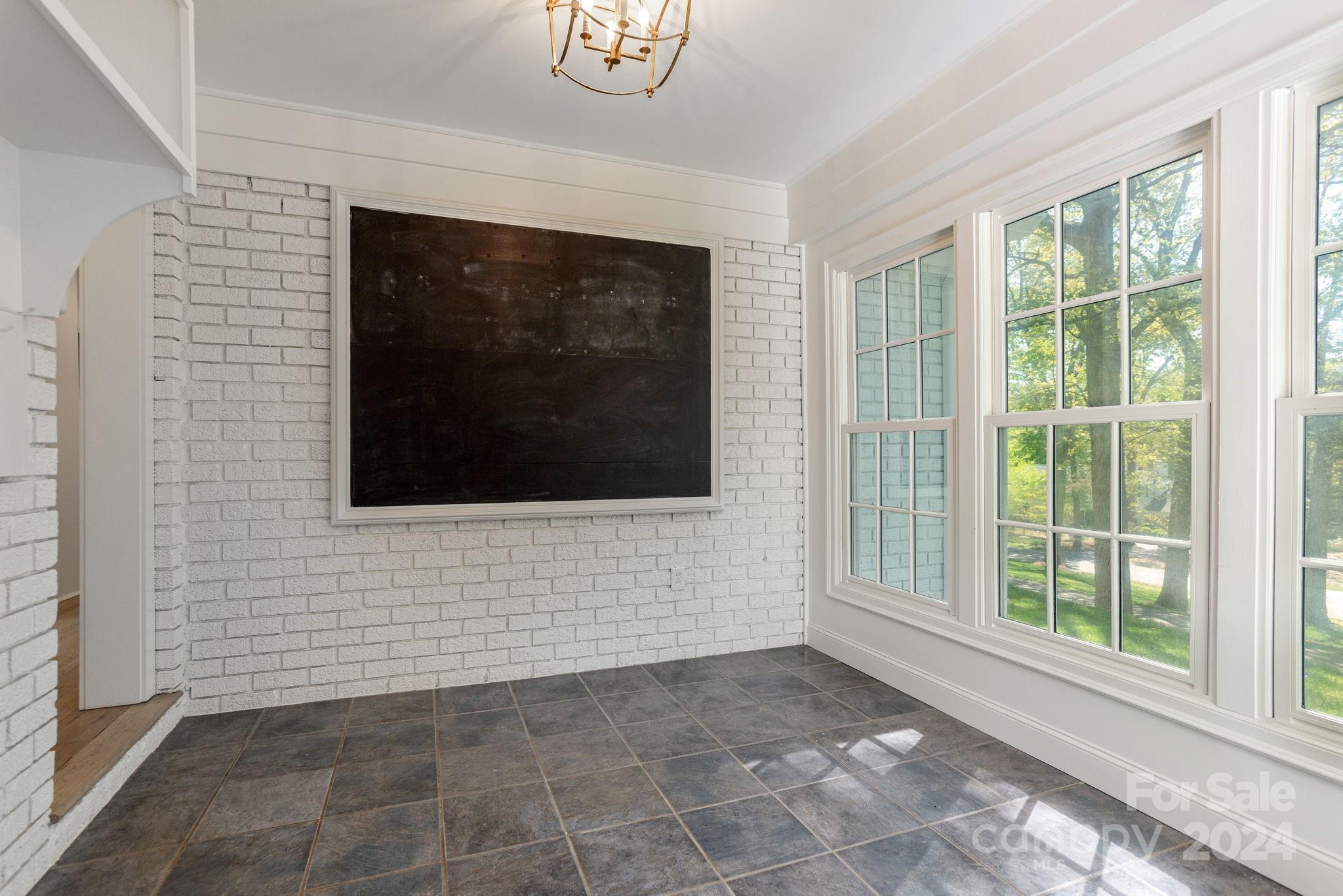 51 Forest Road Asheville, NC 28803 - Photo 36 of 45 a view of an empty room with windows