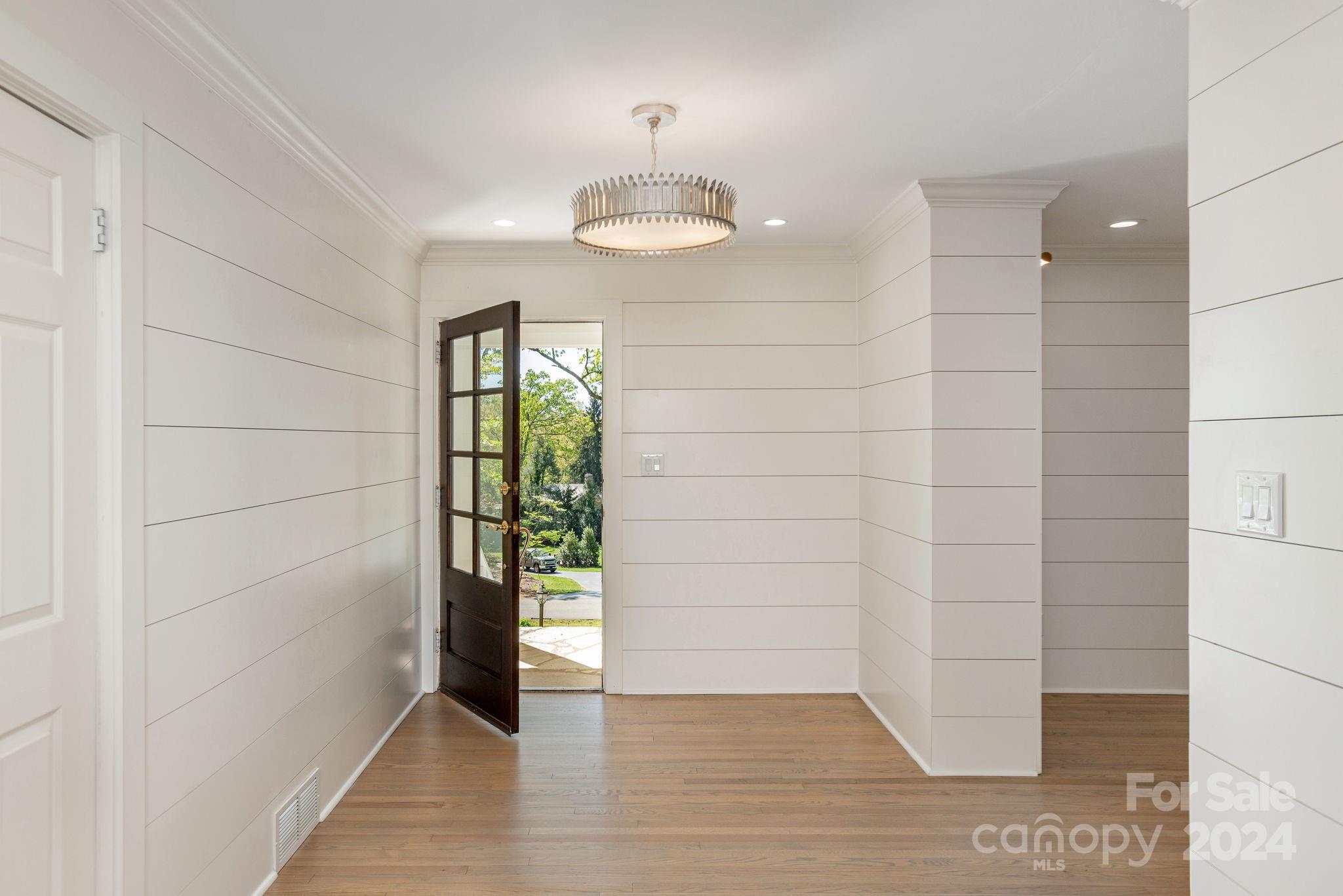 51 Forest Road Asheville, NC 28803 - Photo 5 of 45 a view of an entryway with wooden floor