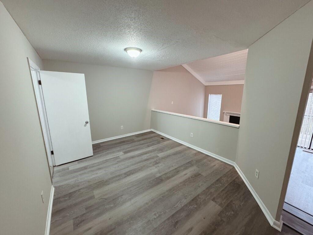 2525 Terrace Trail Decatur, GA 30035 - Photo 1 of 15 an empty room with wooden floor and windows