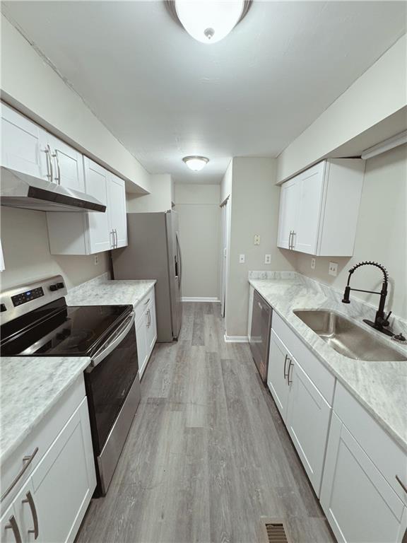 2525 Terrace Trail Decatur, GA 30035 - Photo 11 of 15 a kitchen with a sink a stove and cabinets