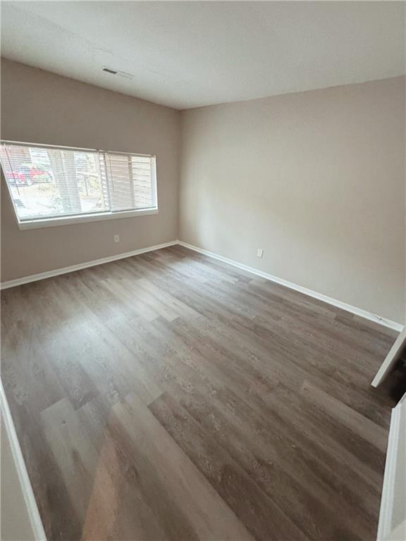 2525 Terrace Trail Decatur, GA 30035 - Photo 7 of 15 an empty room with wooden floor and windows