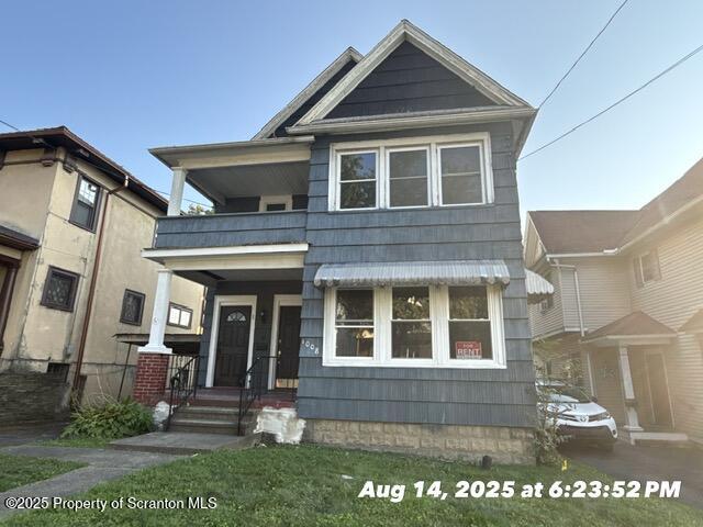 a front view of a house with a porch