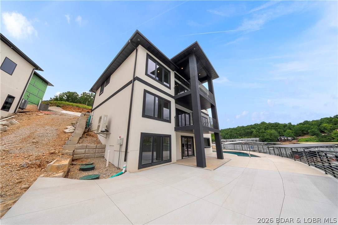439 Red Bud Road Lake Ozark, MO 65049 - Photo 91 of 98 Grand exterior showcasing striking contemporary ar