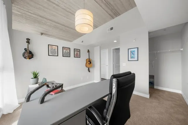 a view of a livingroom with furniture
