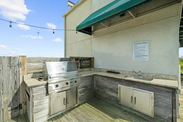 a kitchen with a sink cabinets and stainless steel appliances