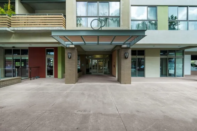 a view of a dinning room with a table and chairs