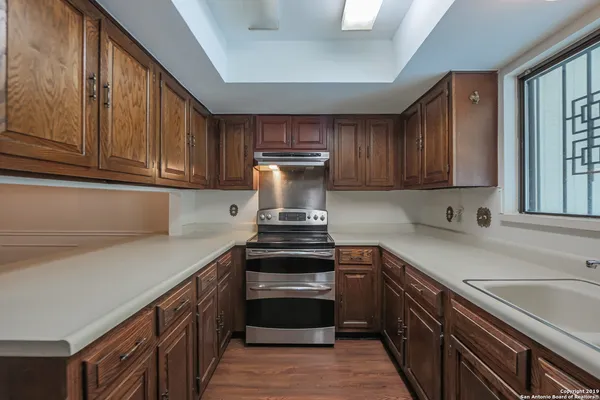 a view with a sink and a cabinets