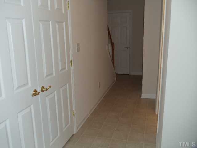 5413 Vista View Court Raleigh, NC 27612 - Photo 12 of 23 lower level hall, utility closet and storage closet.