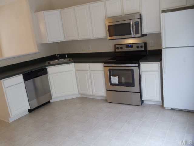 5413 Vista View Court Raleigh, NC 27612 - Photo 4 of 23 Kitchen- New vinyl flooring, new dishwasher, new range/oven, new microwave, freshly painted