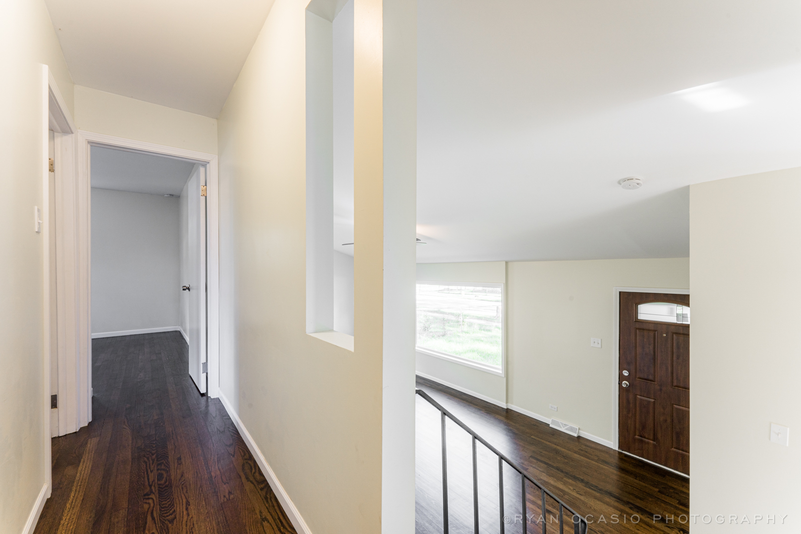 15318 Birch Road Markham, IL 60428 - Photo 12 of 26 a view of a hallway with wooden floor and staircase