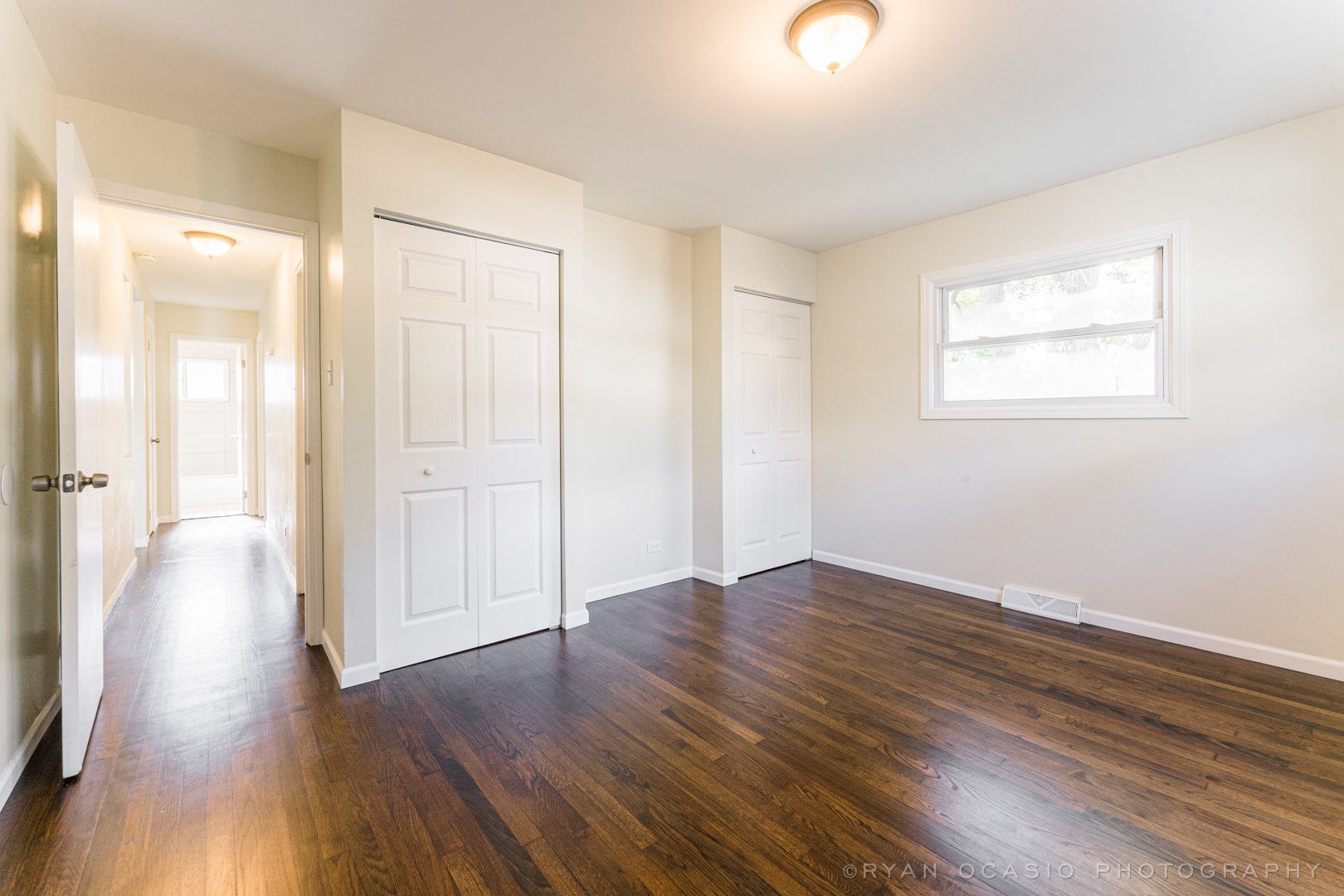 15318 Birch Road Markham, IL 60428 - Photo 14 of 26 a view of an empty room with wooden floor