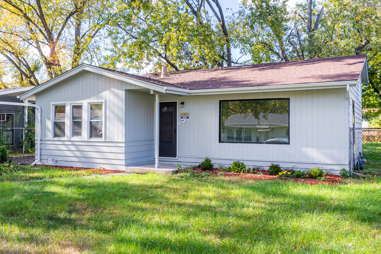 15318 Birch Road Markham, IL 60428 - Photo 3 of 26 a front view of house with yard and trees