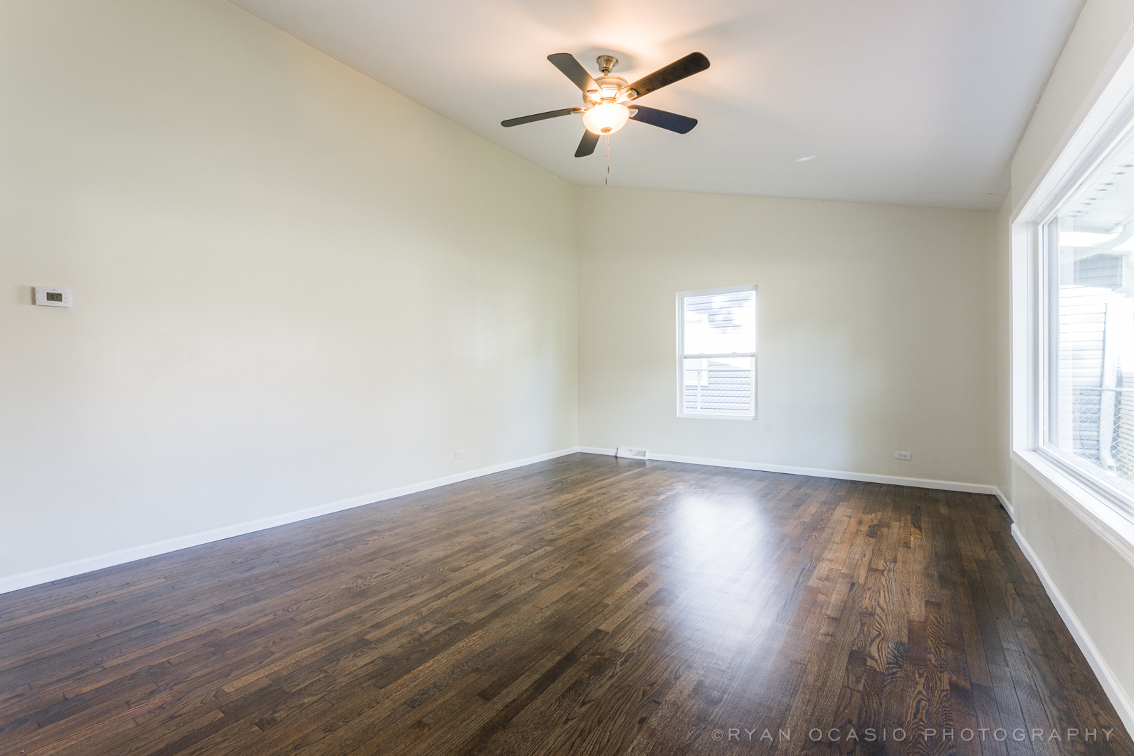 15318 Birch Road Markham, IL 60428 - Photo 4 of 26 wooden floor in an empty room with a window