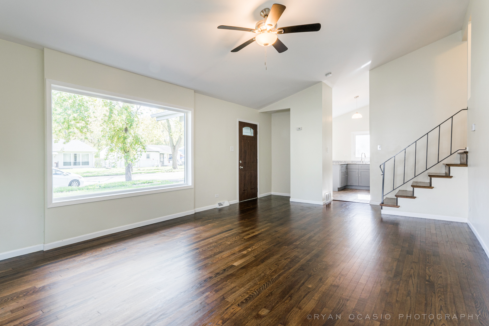 15318 Birch Road Markham, IL 60428 - Photo 6 of 26 a view of empty room with wooden floor and fan