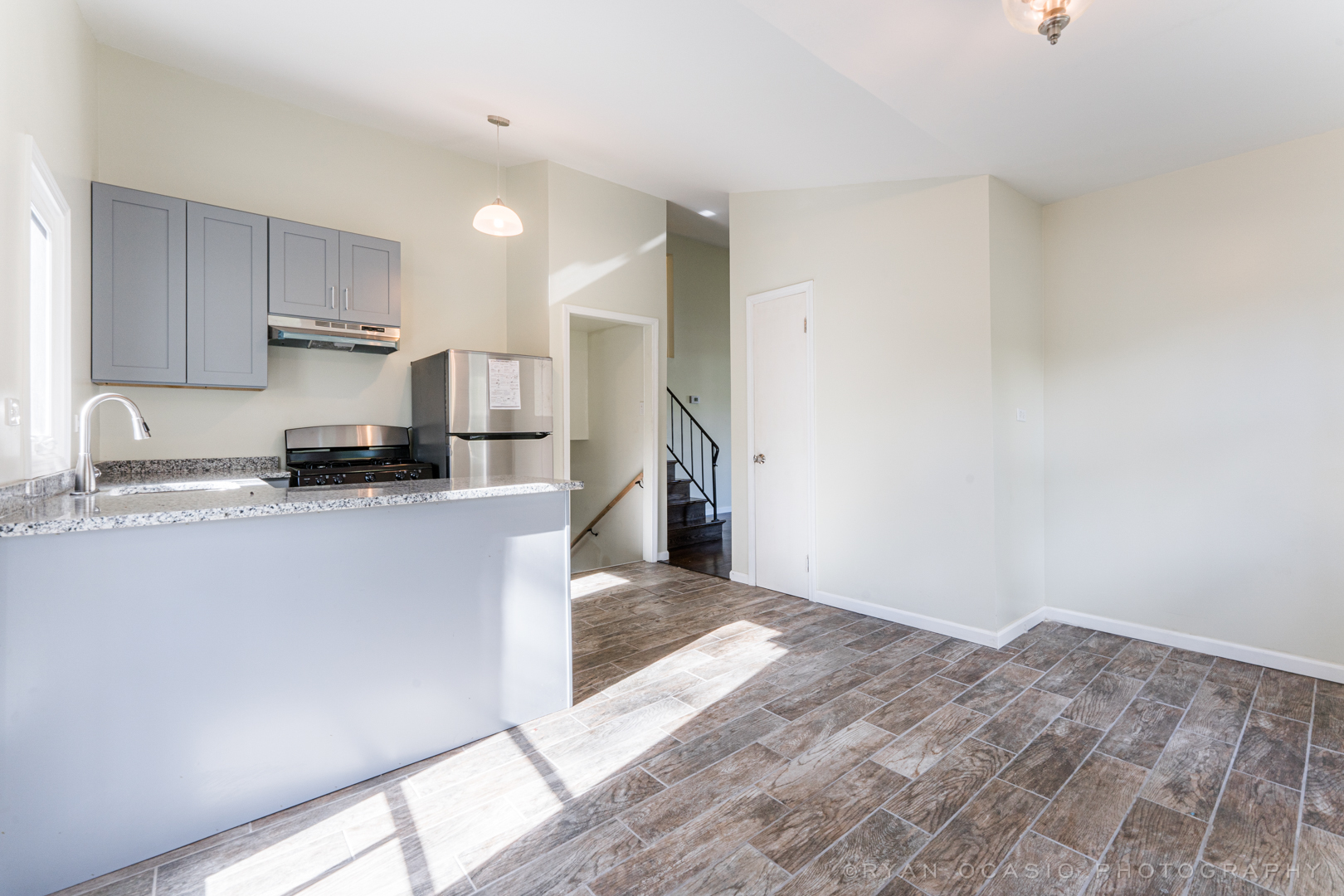 15318 Birch Road Markham, IL 60428 - Photo 9 of 26 a kitchen with a refrigerator and a stove top oven