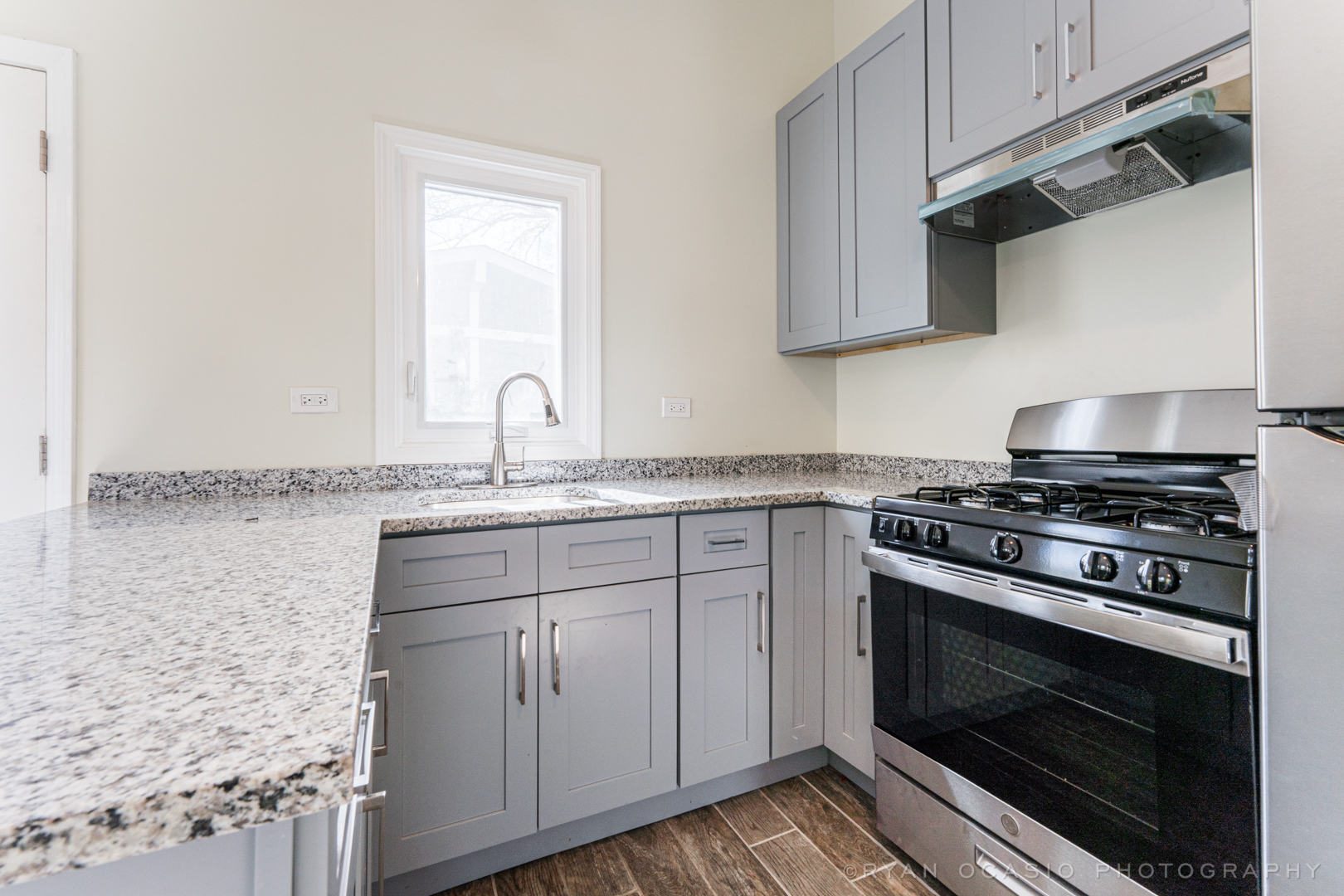 15318 Birch Road Markham, IL 60428 - Photo 10 of 26 a kitchen with granite countertop cabinets stainless steel appliances and sink