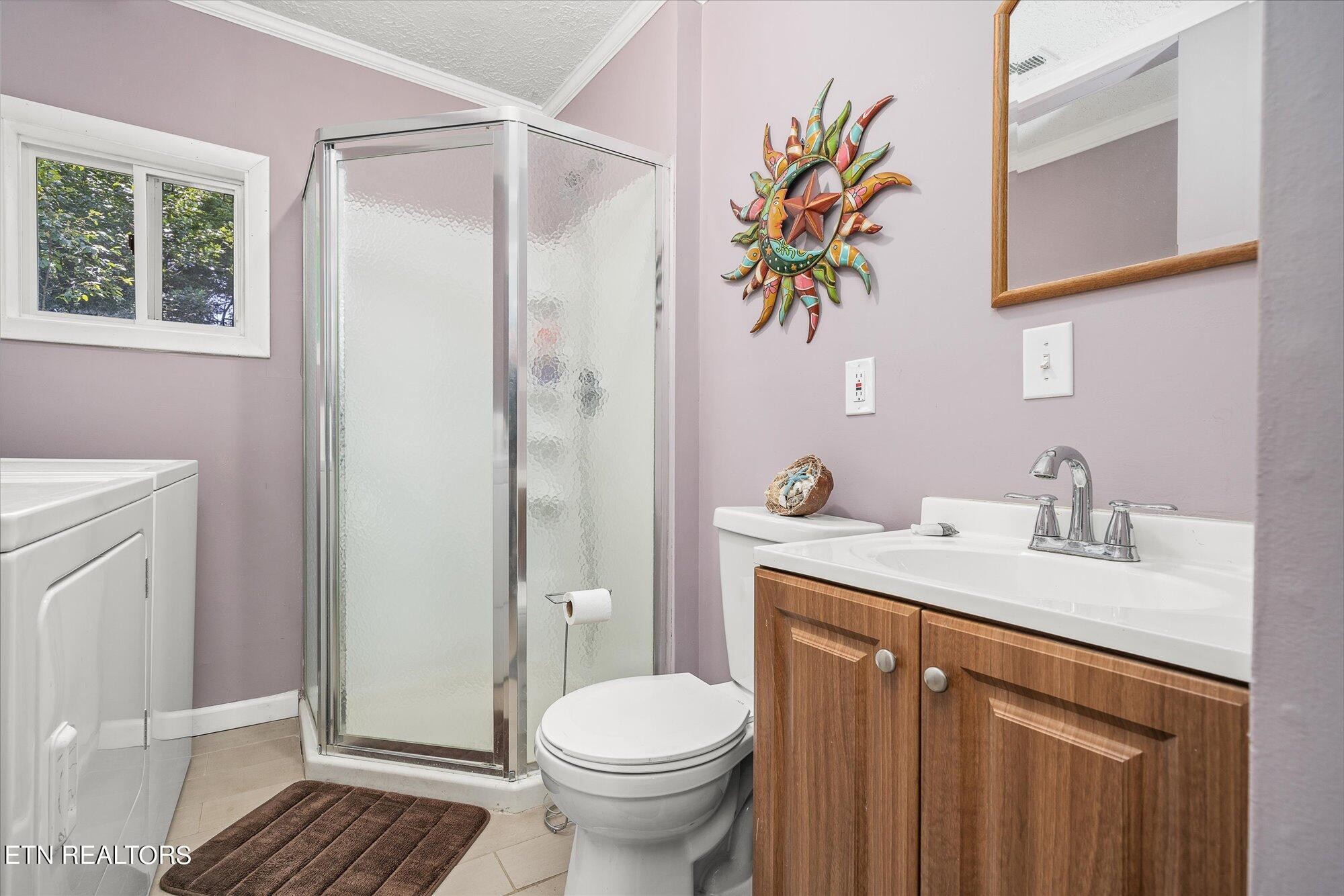 876 Shady Grove Road Lancing, TN 37770 - Photo 17 of 23 a bathroom with a sink a toilet and shower