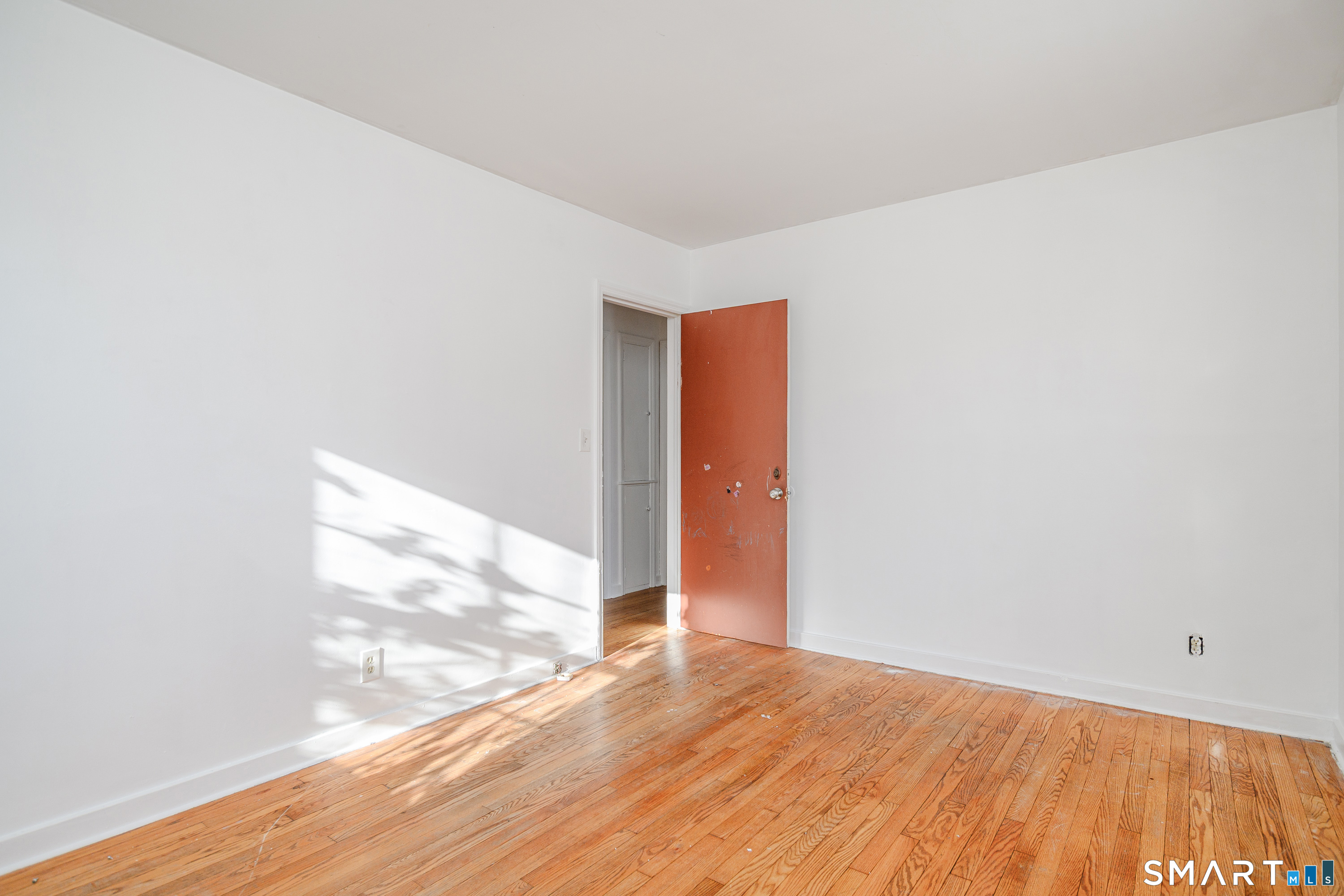 8 1st St Extension Danbury, CT 06810 - Photo 15 of 23 a view of empty room with wooden floor