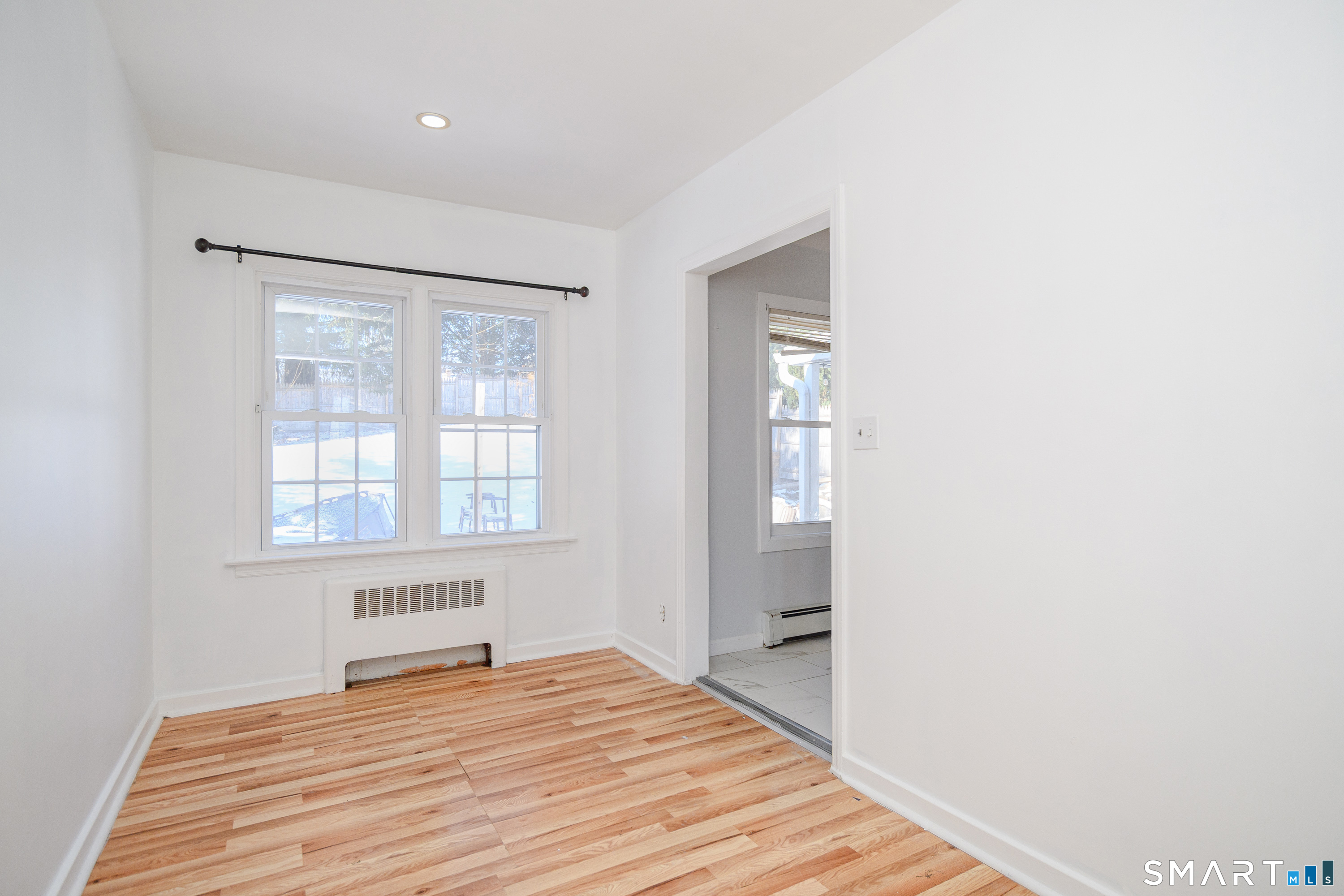 8 1st St Extension Danbury, CT 06810 - Photo 18 of 23 a bedroom with a bed and a window