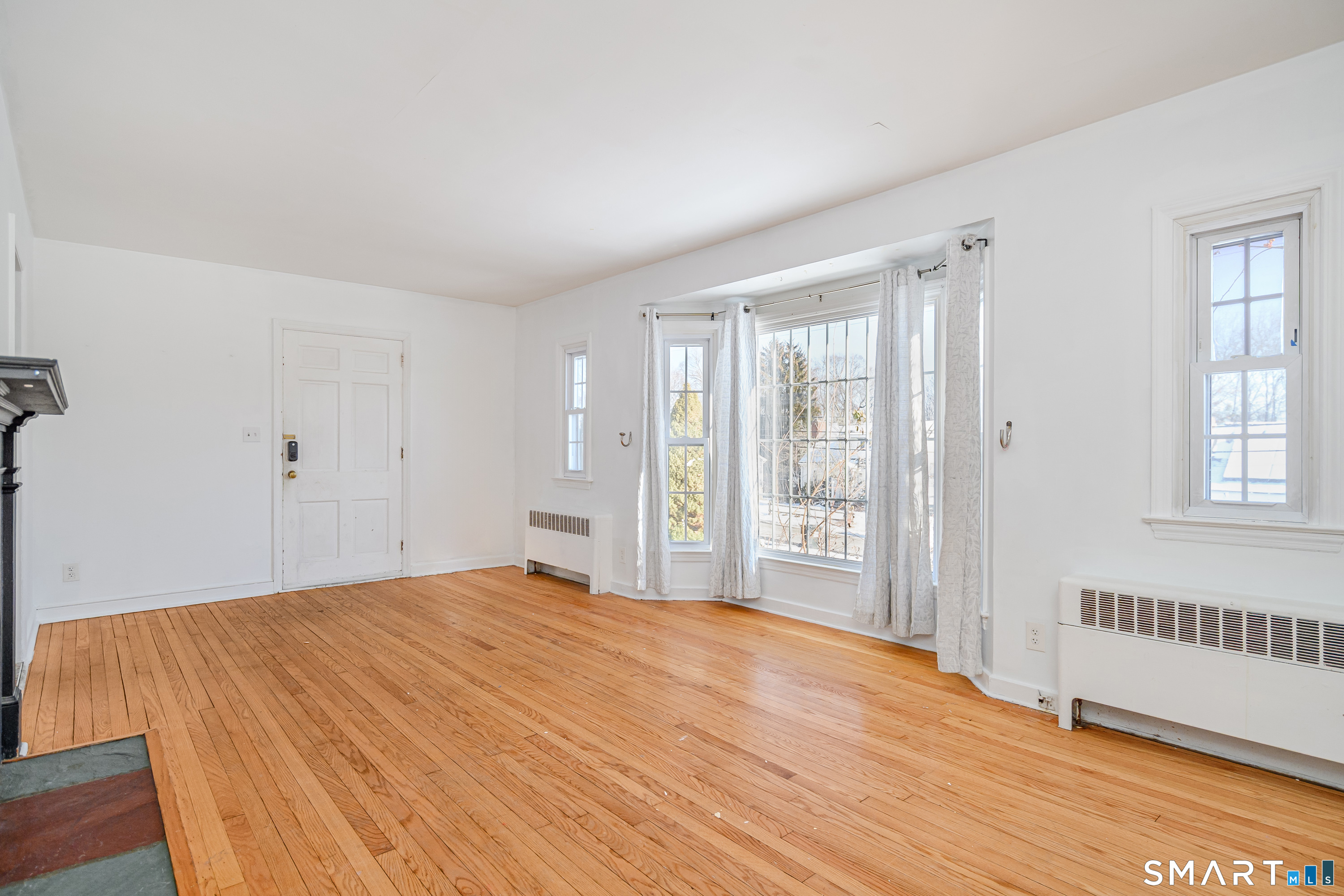 8 1st St Extension Danbury, CT 06810 - Photo 7 of 23 a bedroom with a bed and a window
