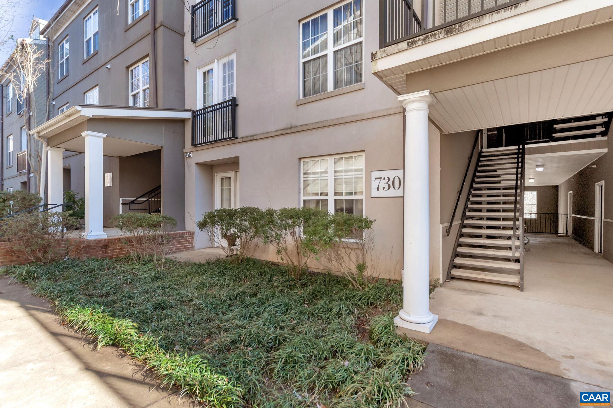 730 Walker Square, Unit 2D Charlottesville, VA 22903 - Photo 2 of 19 front view of a house with a yard