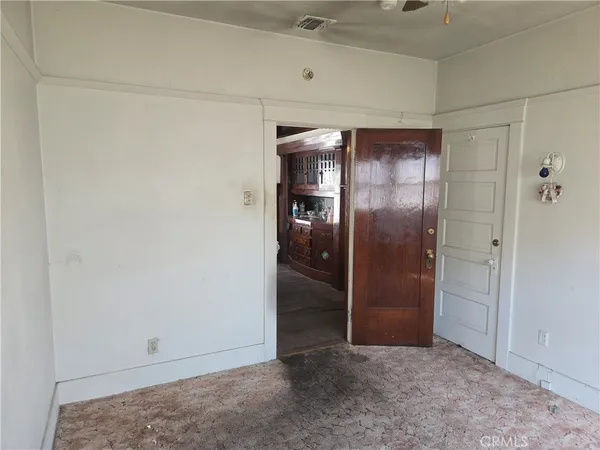 an empty room with a empty space and windows