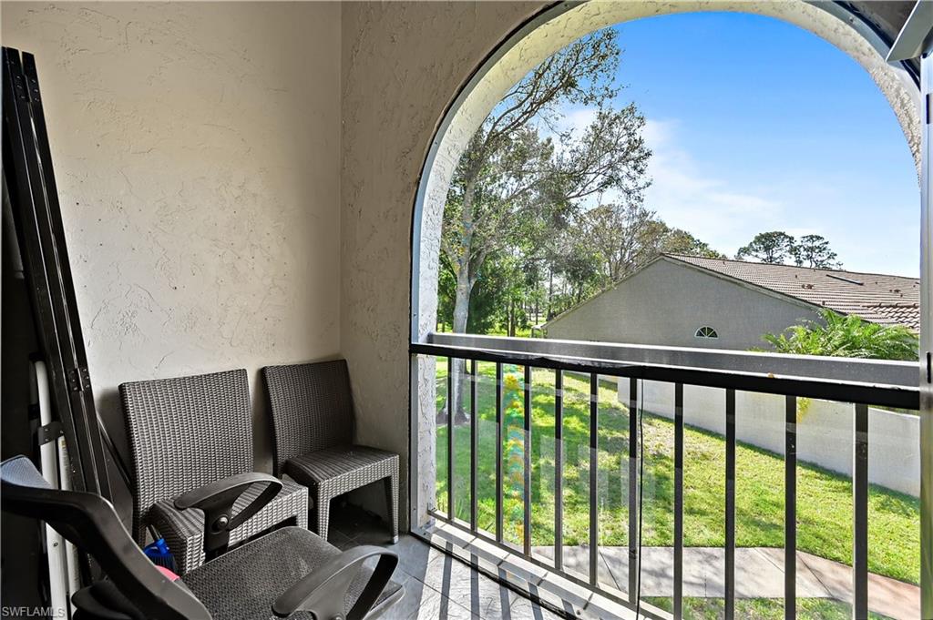 938 Augusta Boulevard, Unit D937 Naples, FL 34113 - Photo 22 of 27 a view of a workspace with furniture and a window