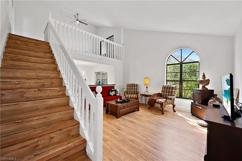938 Augusta Boulevard, Unit D937 Naples, FL 34113 - Photo 5 of 27 a living room with furniture and a large window