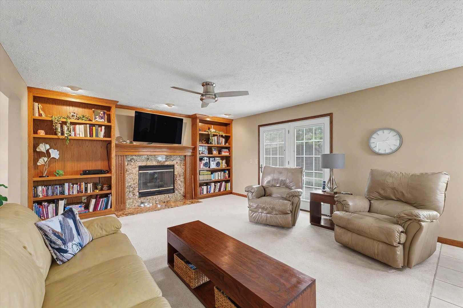 4409 Copper Ridge Road Champaign, IL 61822 - Photo 9 of 40 a living room with fireplace furniture and a flat screen tv