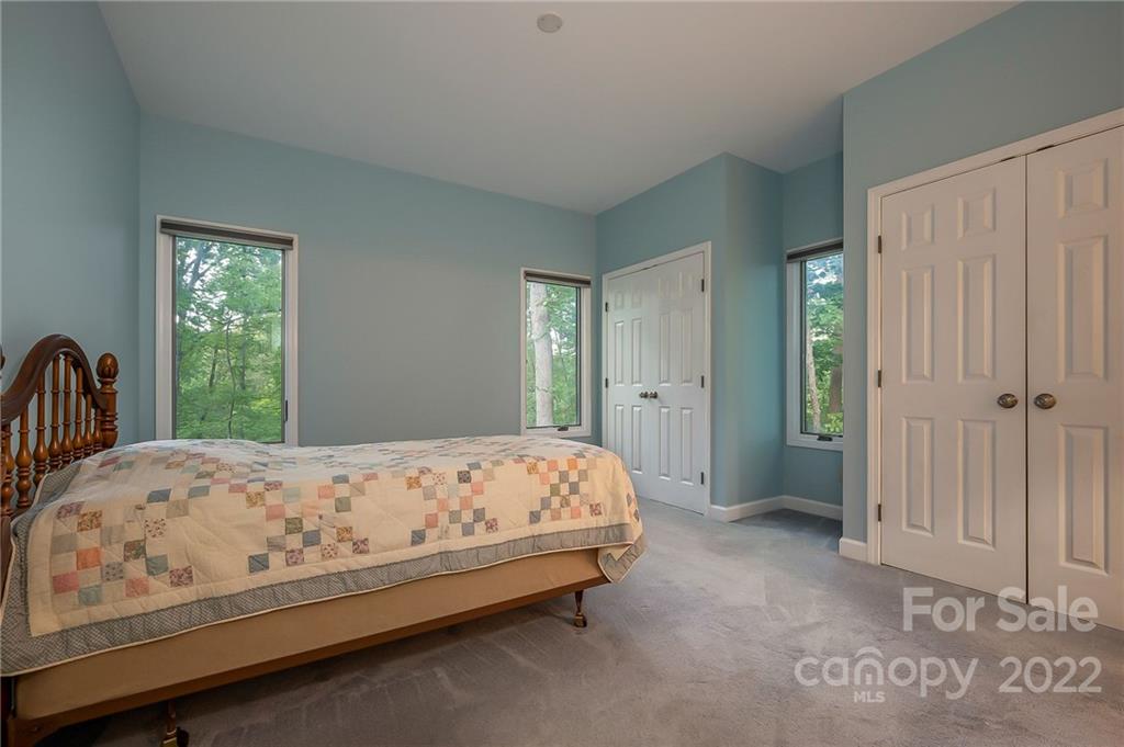 161 Walker Road Mill Spring, NC 28756 - Photo 34 of 47 a bedroom with a bed and a window