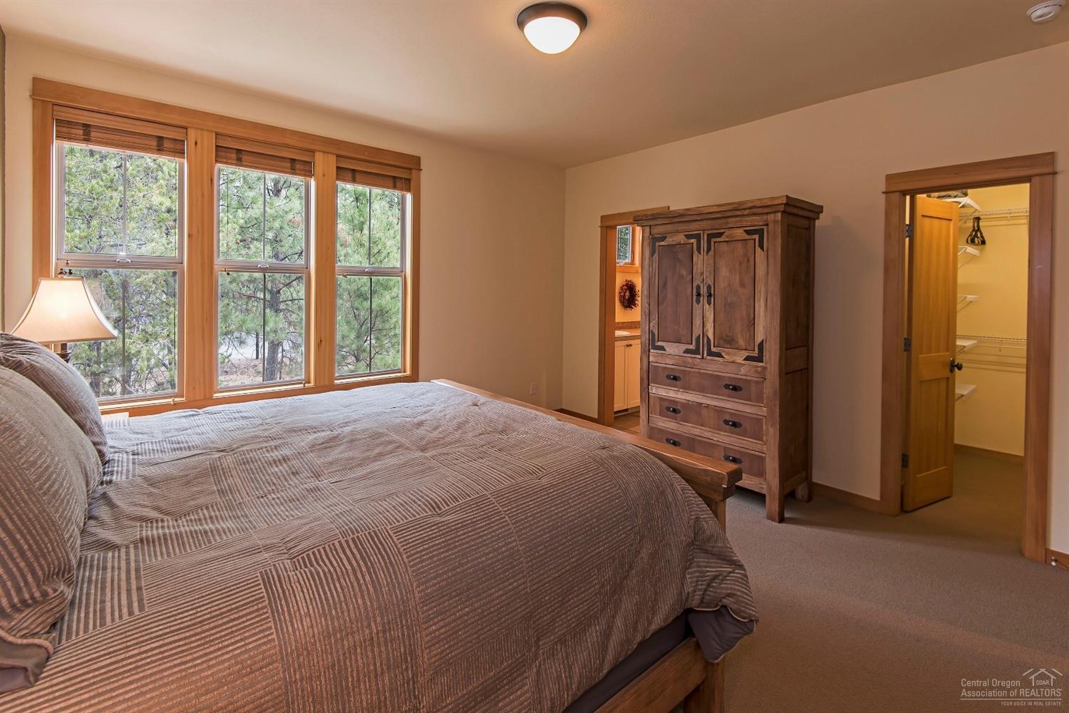 57166 Evergreen Loop Sunriver, OR 97707 - Photo 8 of 19 King master bedroom is a sunny and seren