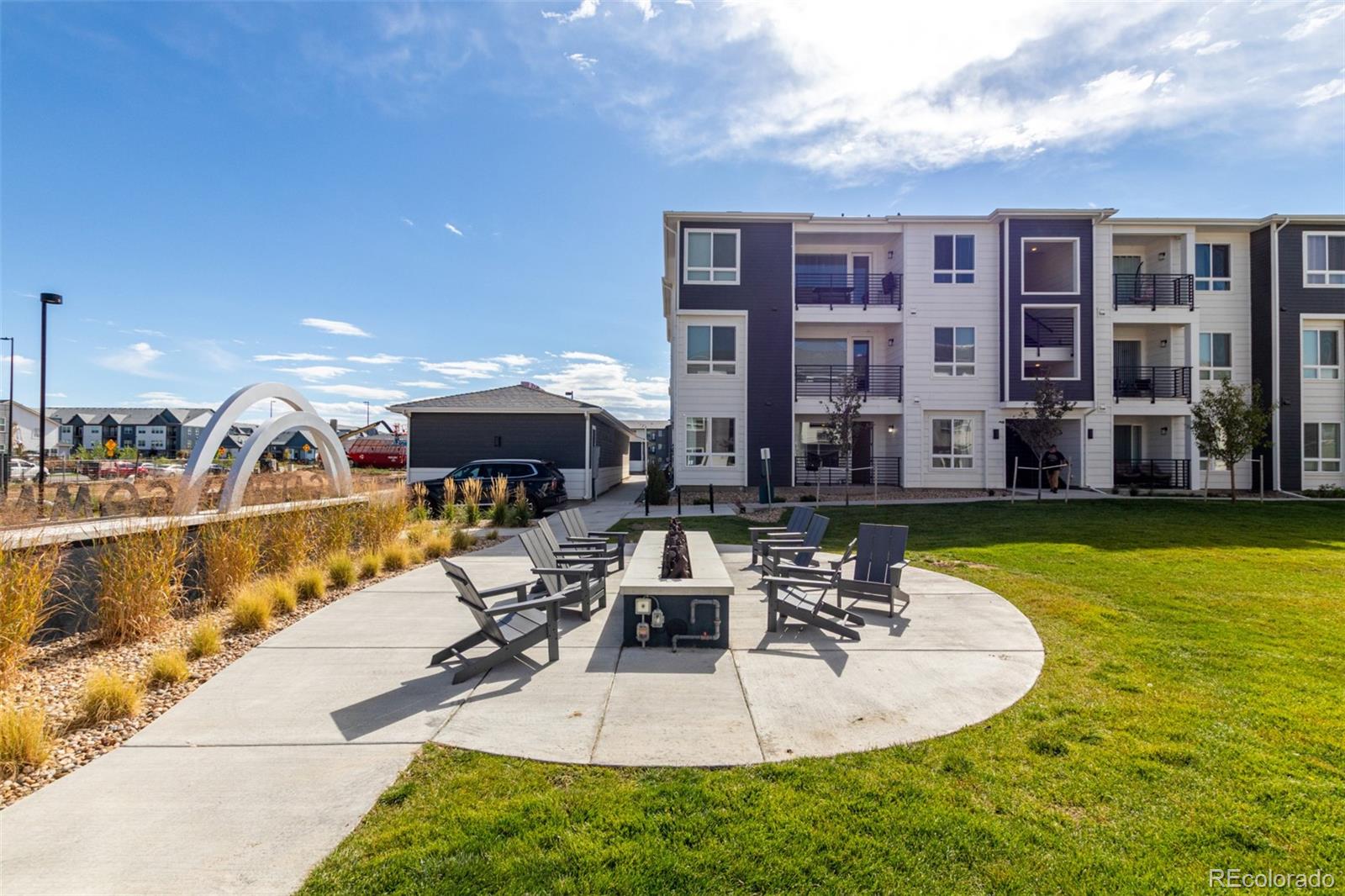 a swimming pool with outdoor seating yard and barbeque oven