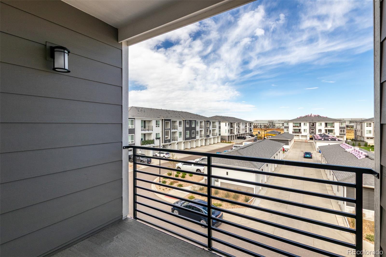 6153 North Ceylon Street, Unit 204 Denver, CO 80249 - Photo 18 of 22 a view of a balcony with city view