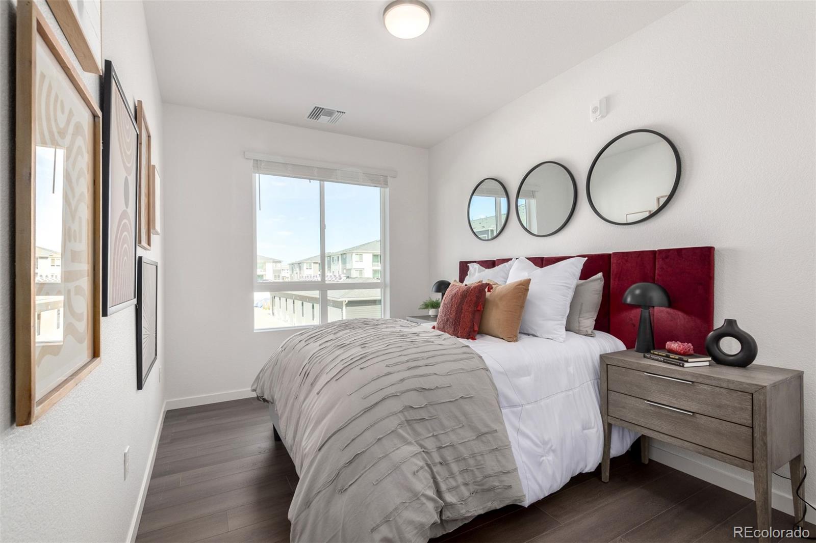 6153 North Ceylon Street, Unit 204 Denver, CO 80249 - Photo 9 of 22 a bedroom with a bed and window