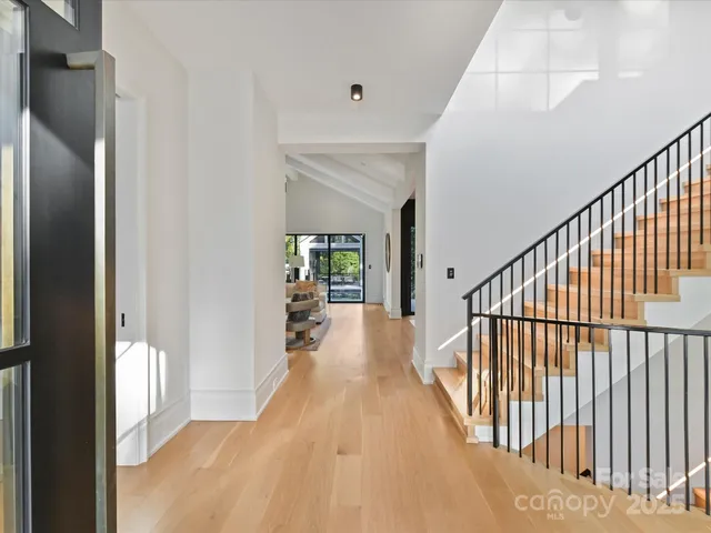 a view of a hallway view with staircase