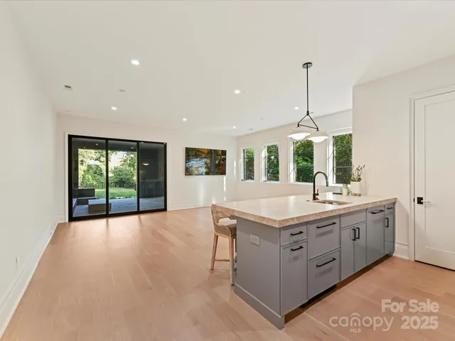 a view of kitchen and kitchen with a chandelier