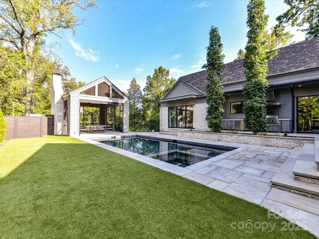 a front view of a house with yard and porch