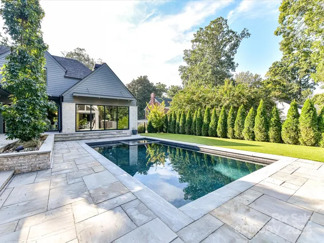a view of swimming pool with chairs