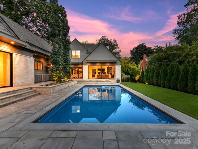 a view of swimming pool with outdoor seating