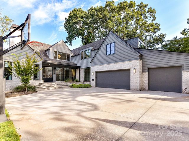 a house with trees in the background