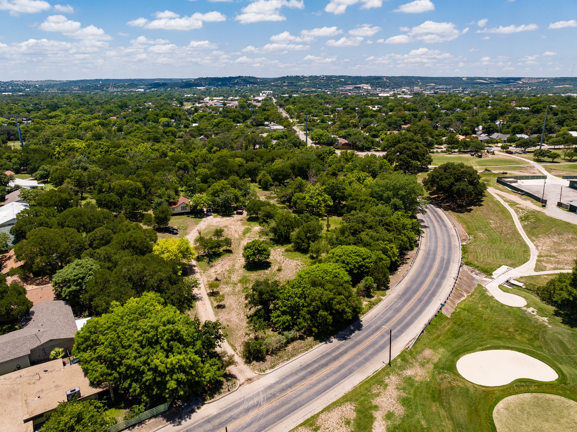 951 Cypress Creek Road Kerrville, TX 78028 - Photo 12 of 30 a view of a houses with a garden