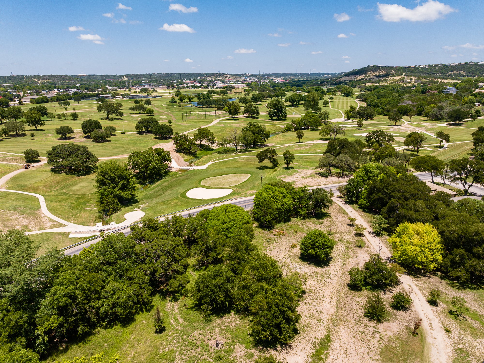 951 Cypress Creek Road Kerrville, TX 78028 - Photo 17 of 30 a view of a large building with lots of trees