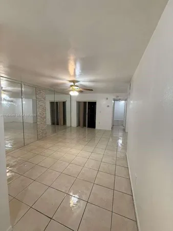 a view of a hallway with an empty room